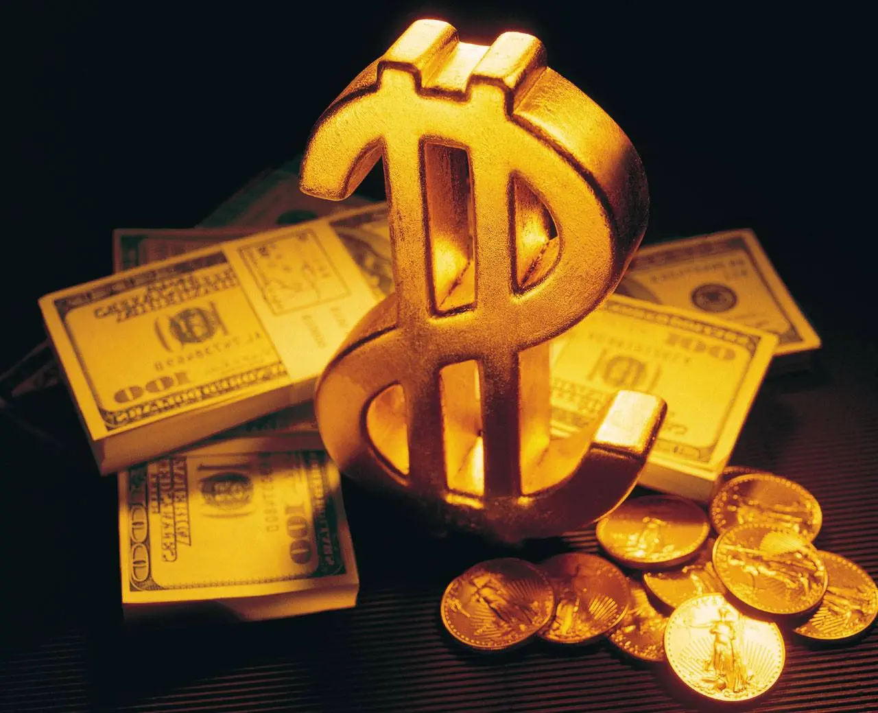 Gambar emas batangan melambangkan uang dan koin